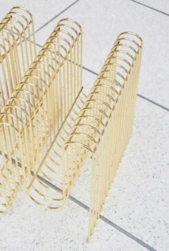 AYTM Curva Magazine Rack, Gold -Gubi Furni Sales aytm curva magazine holder 30